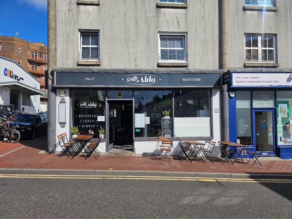 Caffè Aldo's charcoal awning and pavement terrace at 77 Trafalgar Street